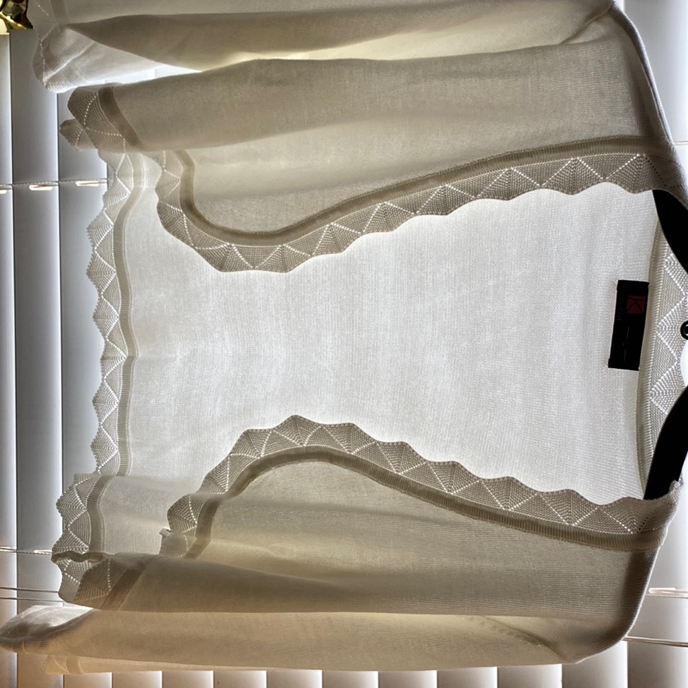 Brand new 65% viscose and 35% acrylic. Shrug with scalloped trim detailed
